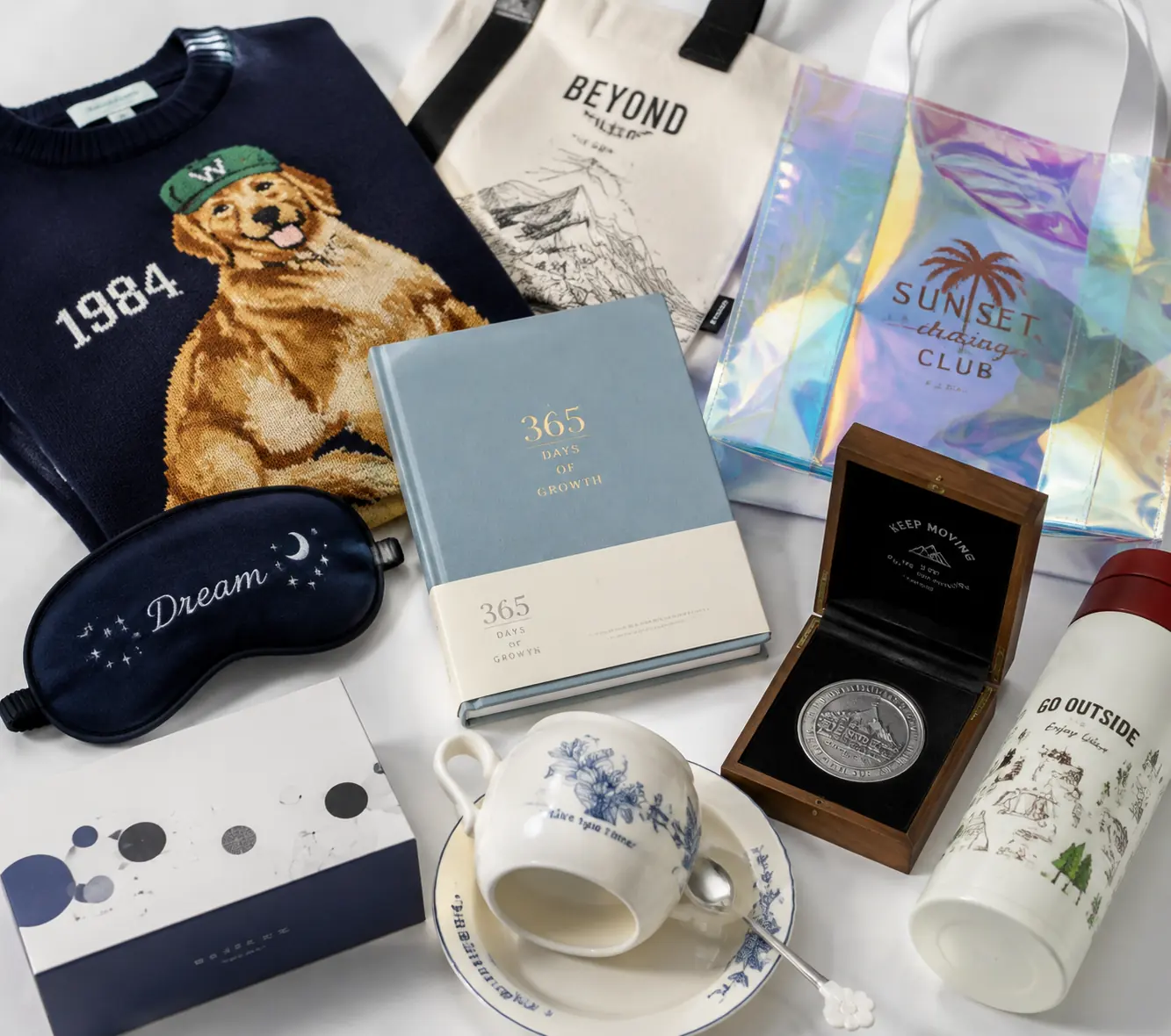 Custom sourced merchandise collection including apparel, bags, stationery, drinkware, gifts and packaging