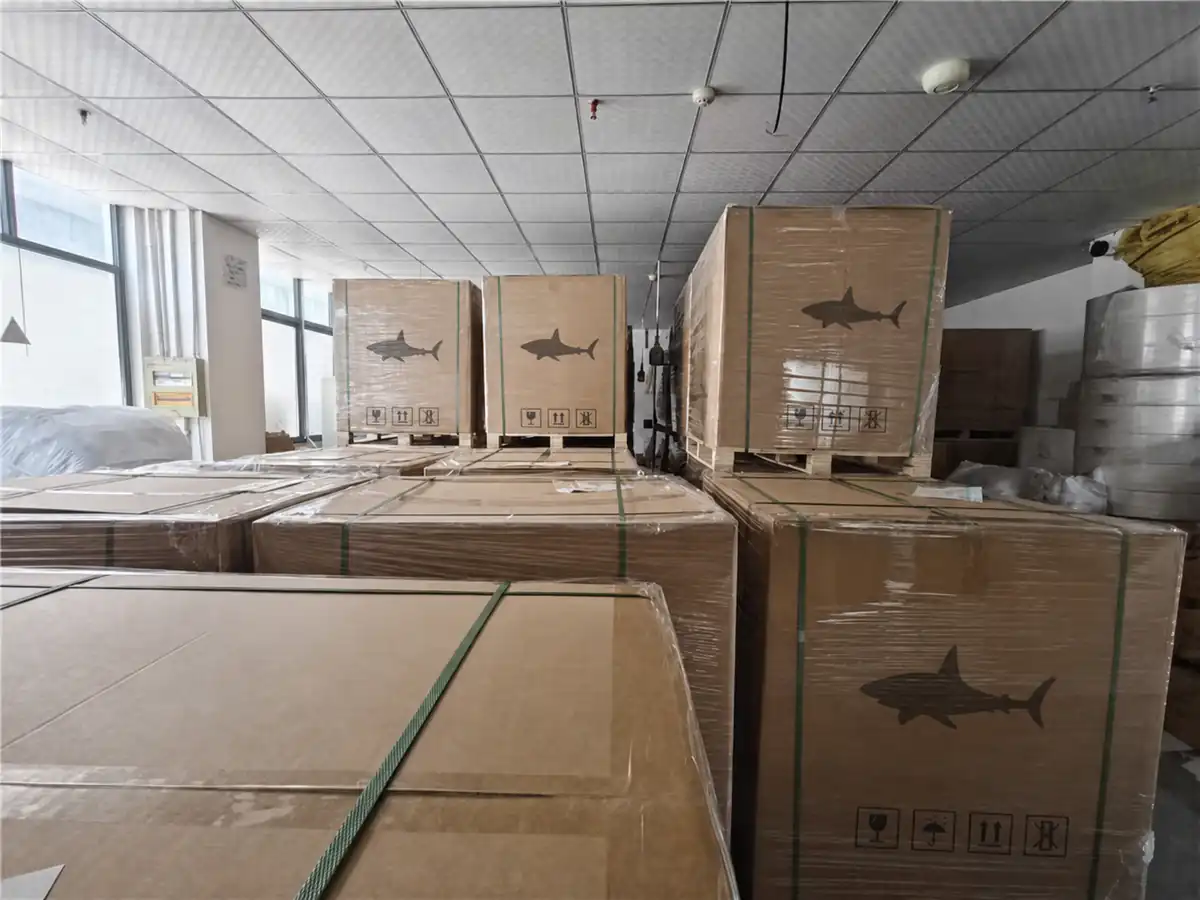Anonymized export cartons marked with generic shark symbols