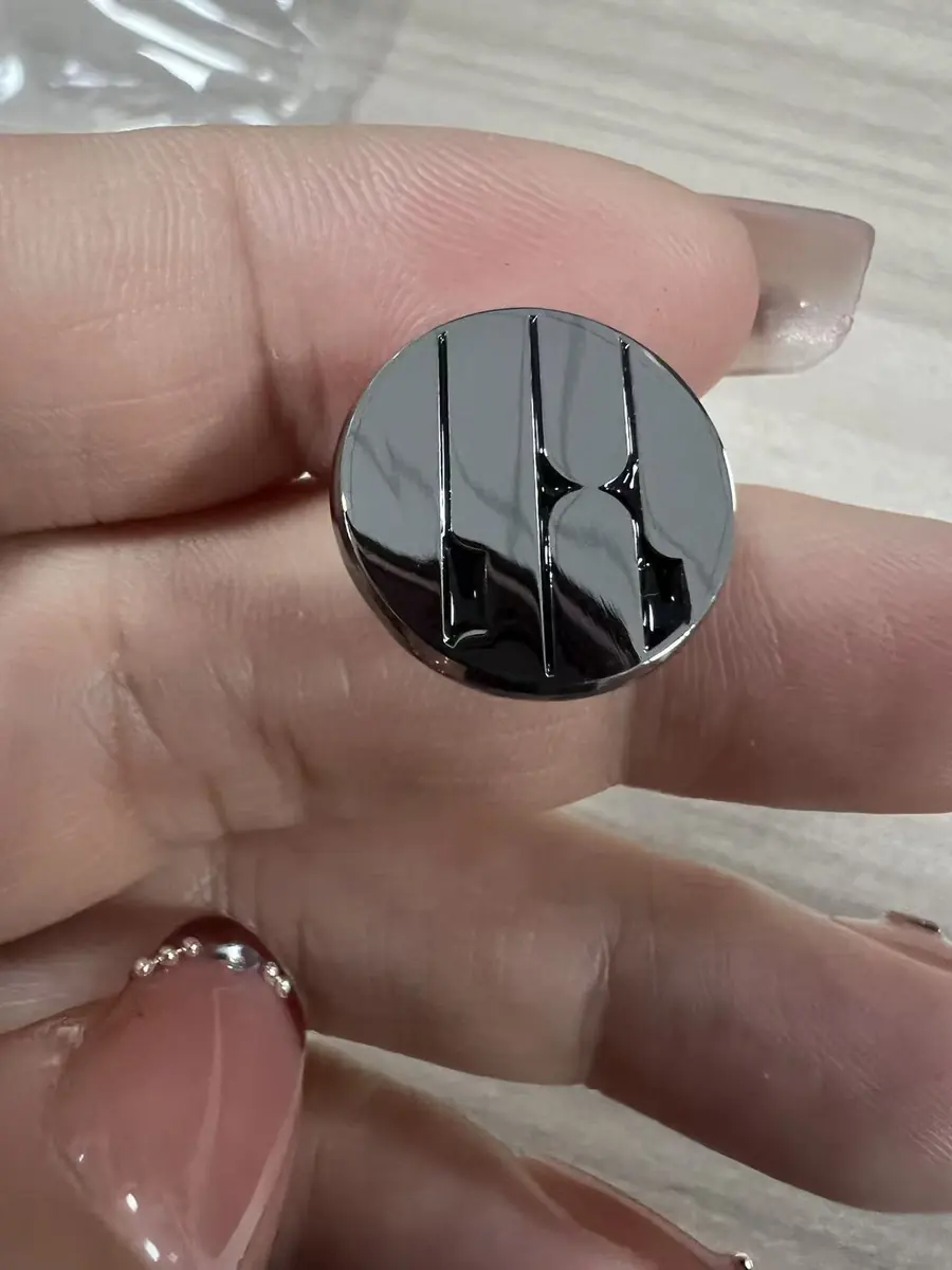 Complete round black enamel and nickel-plated band pin