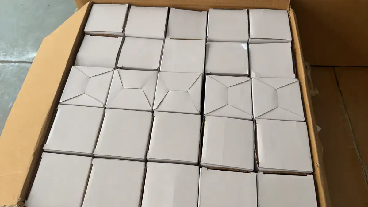Anonymized individual bottle boxes arranged in an export carton
