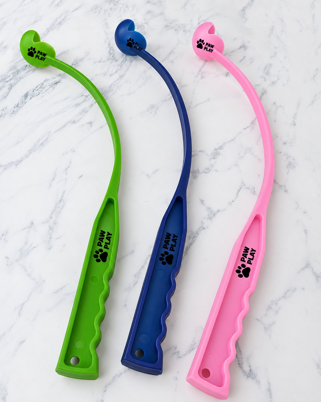 Anonymized logo mockup on green, navy and pink manual dog ball launchers