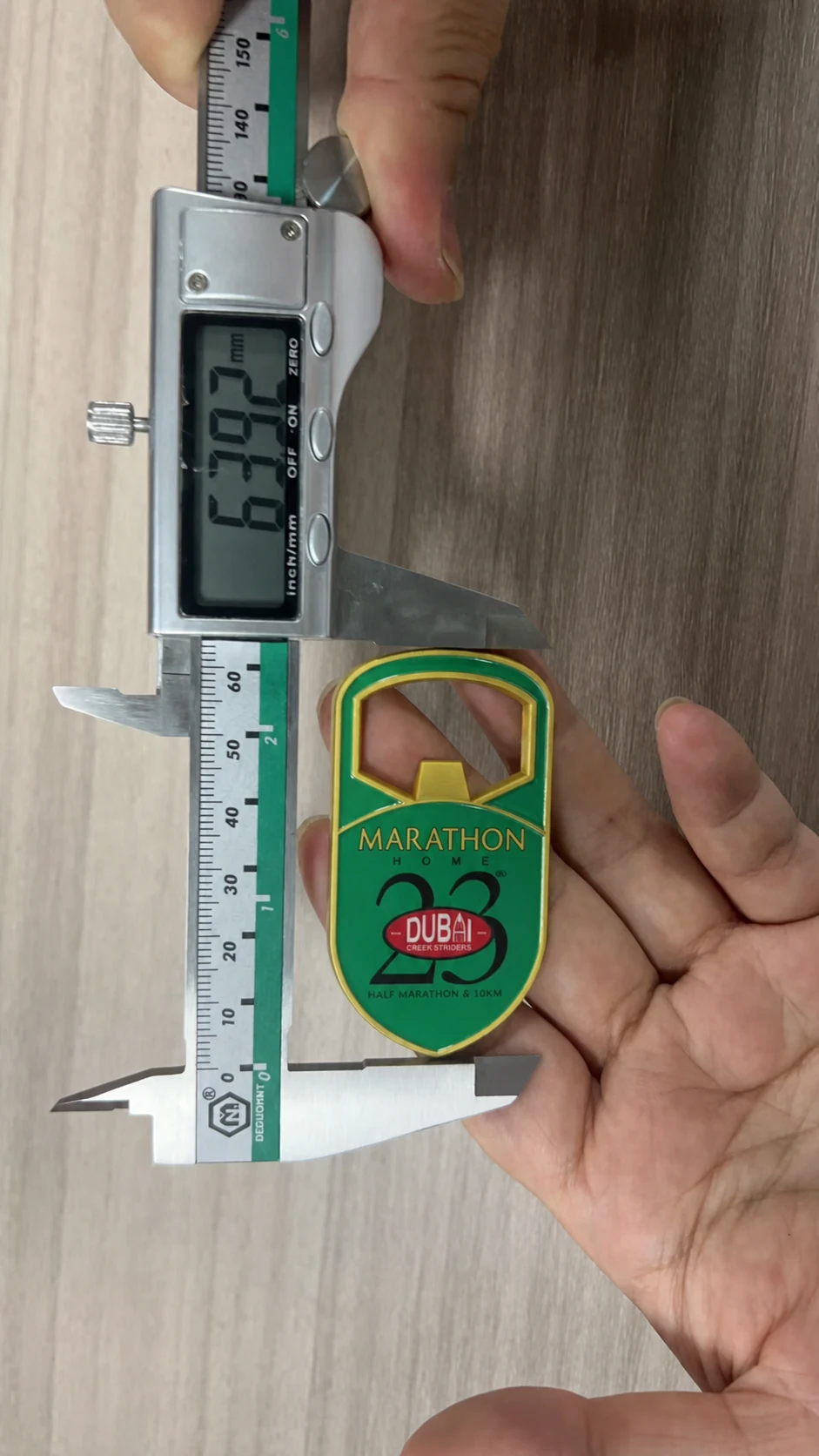 Bottle-opener magnet height measured at 63.92 millimetres