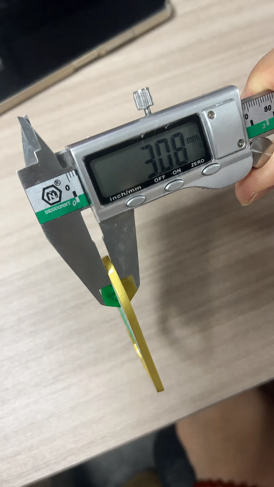Bottle-opener magnet thickness measured at 3.08 millimetres