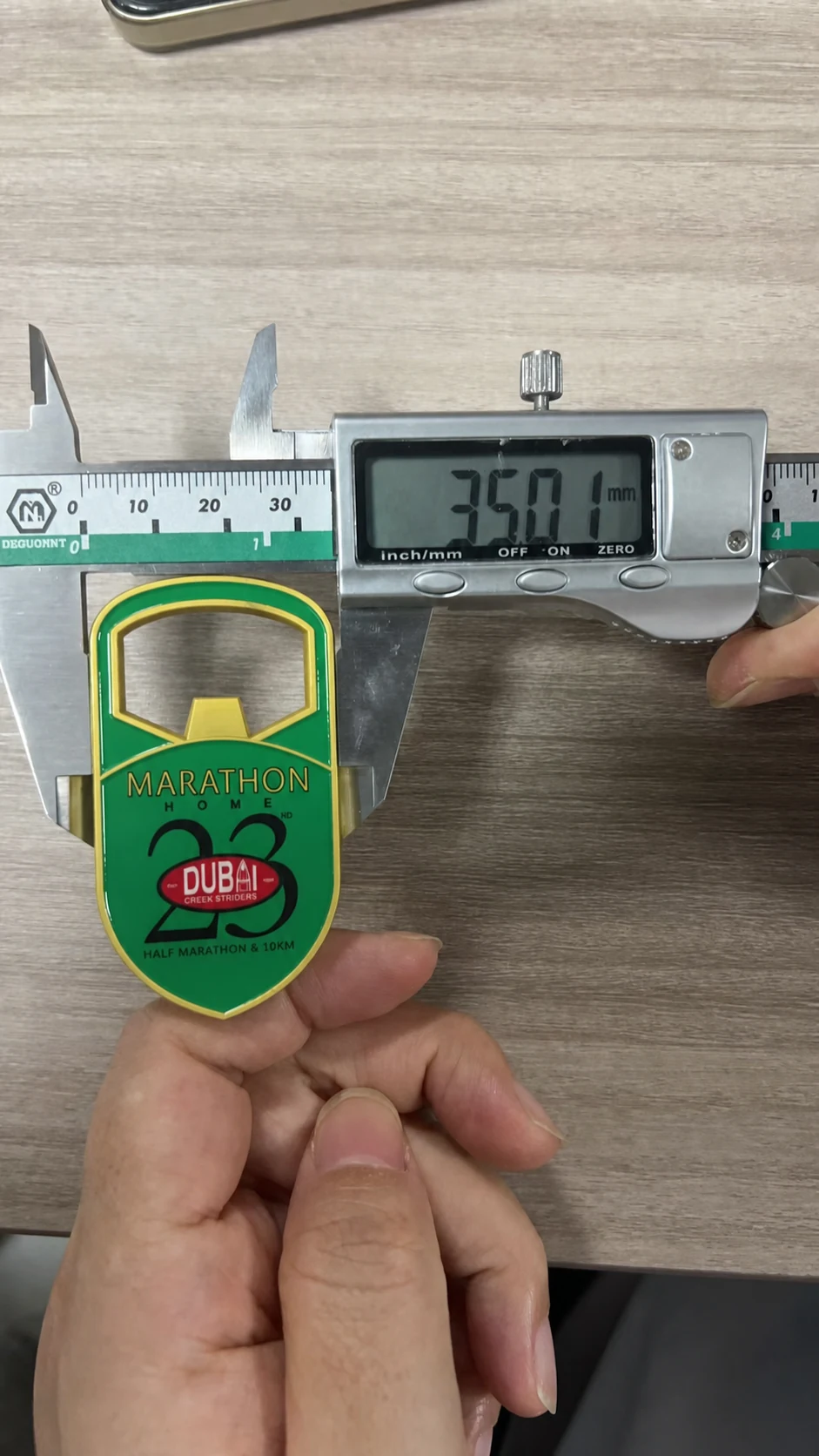 Bottle-opener magnet width measured at 35.01 millimetres